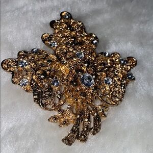 Gold tone faux  diamond costume pin brooch